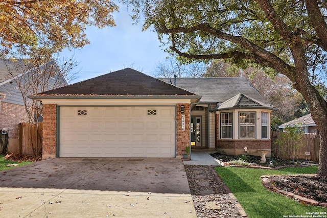 ranch-style home featuring a garage