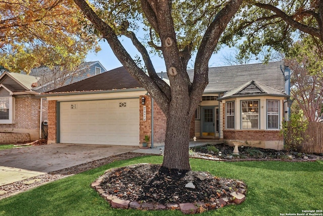 view of front of home featuring a garage and a front lawn