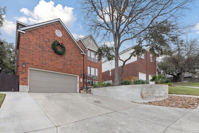 view of side of property with a garage