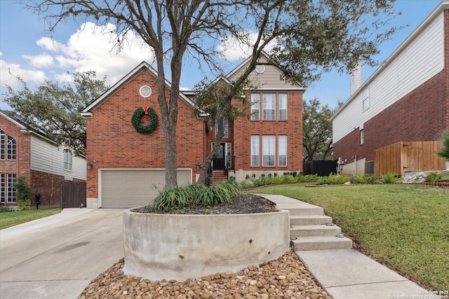 view of property with a front yard and a garage