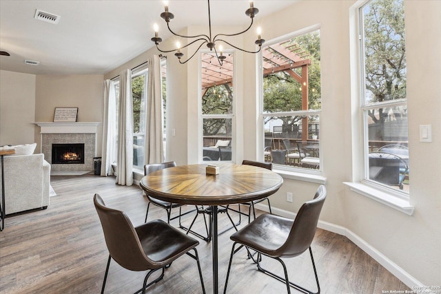 dining room featuring a chandelier and hardwood / wood-style floors