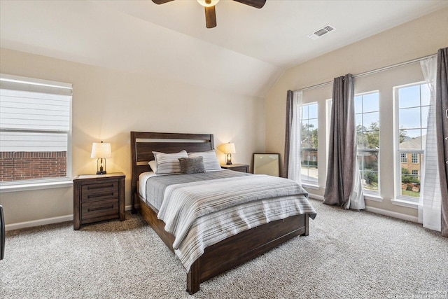 carpeted bedroom featuring ceiling fan, lofted ceiling, and multiple windows