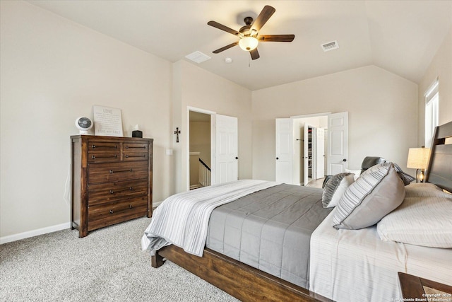 carpeted bedroom featuring ceiling fan and vaulted ceiling