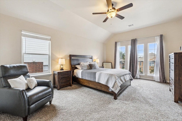 bedroom featuring ceiling fan, light colored carpet, and lofted ceiling