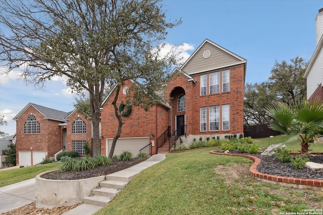 front facade with a front yard and a garage