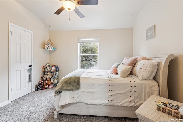 carpeted bedroom with vaulted ceiling and ceiling fan