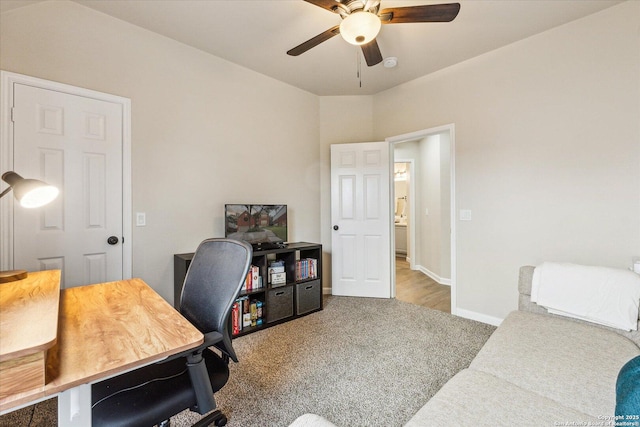 office with carpet floors and ceiling fan