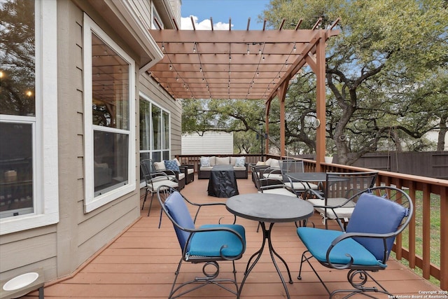 wooden terrace with an outdoor living space and a pergola