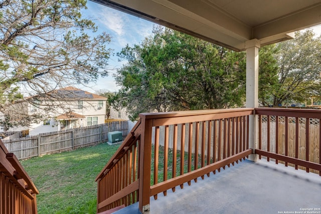 wooden terrace with a yard and central AC