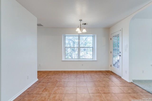 interior space featuring a notable chandelier