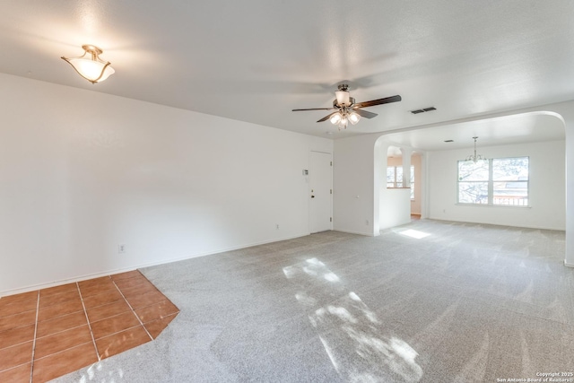 carpeted empty room with ceiling fan