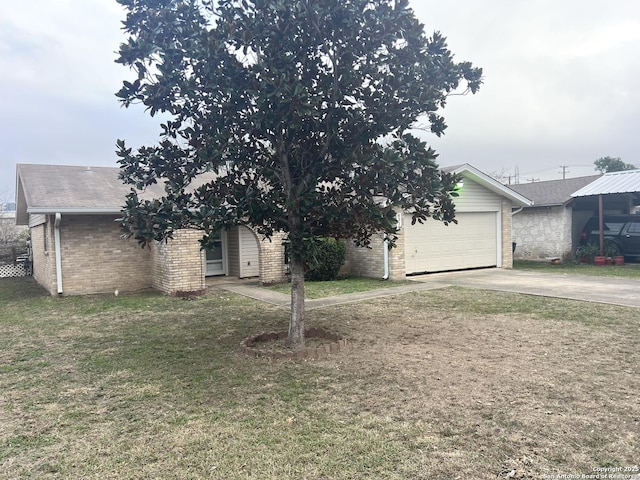 view of front of home with a front yard and a garage