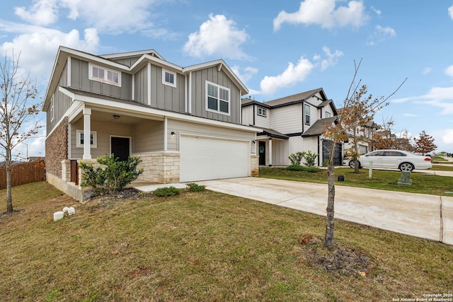 view of front of home with a garage and a front yard