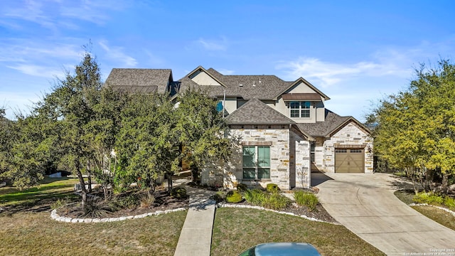 view of front facade featuring a front yard and a garage