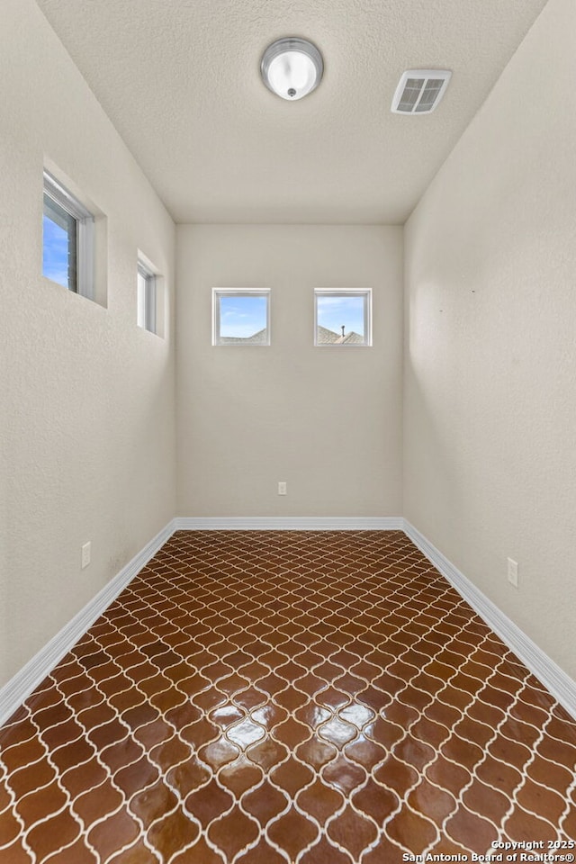 basement with a textured ceiling