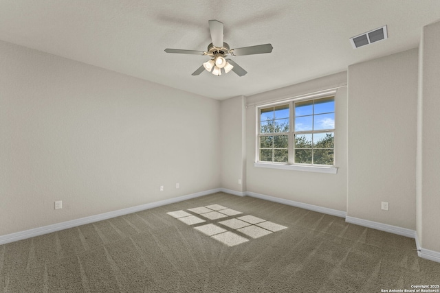 empty room with carpet floors and ceiling fan