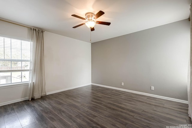 unfurnished room with ceiling fan and dark wood-type flooring