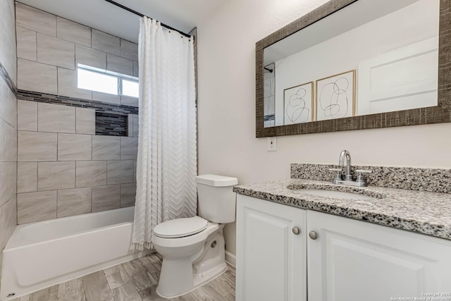 full bathroom featuring shower / bath combo, vanity, and toilet