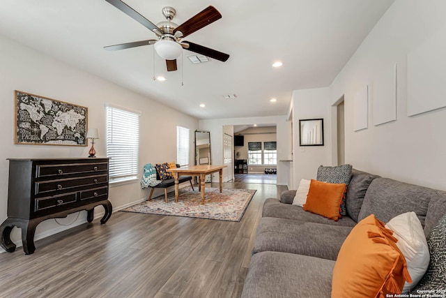 living room with hardwood / wood-style floors and ceiling fan