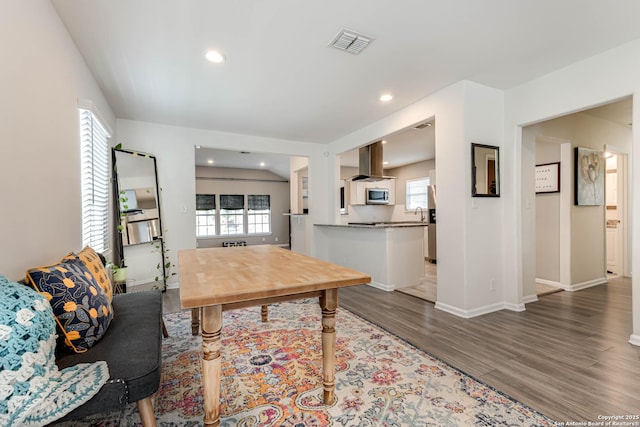 interior space featuring a wealth of natural light and wood-type flooring