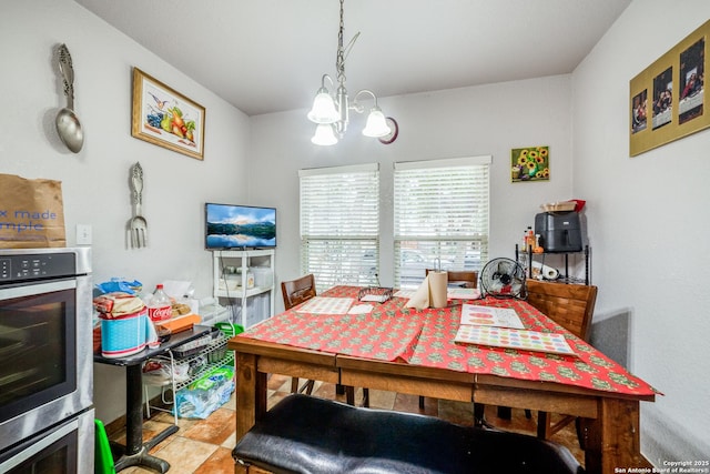 dining space featuring an inviting chandelier