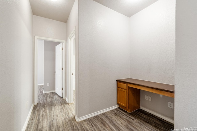 9319 Longmire Trce, San Antonio, TX 78245 - corridor featuring wood finished floors, baseboards, and an office area