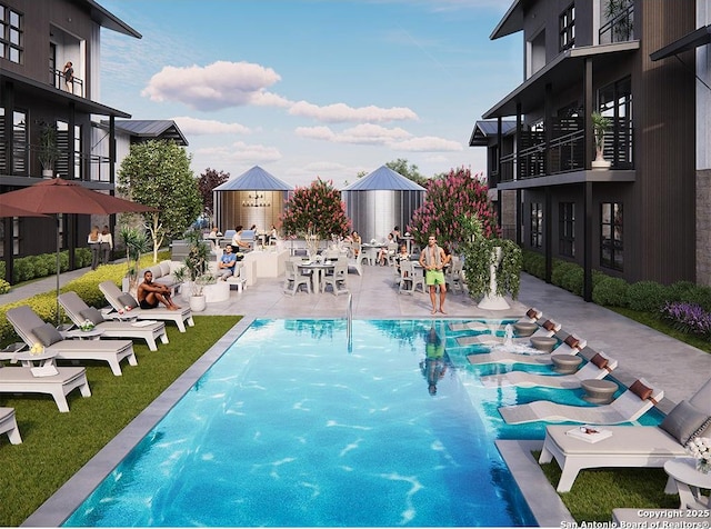 view of pool featuring a patio area and pool water feature