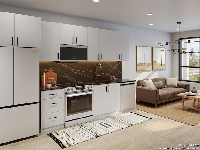 kitchen featuring sink, white cabinets, white appliances, and light hardwood / wood-style flooring