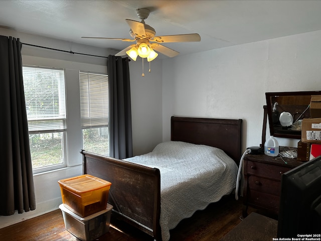 bedroom featuring dark hardwood / wood-style floors and ceiling fan