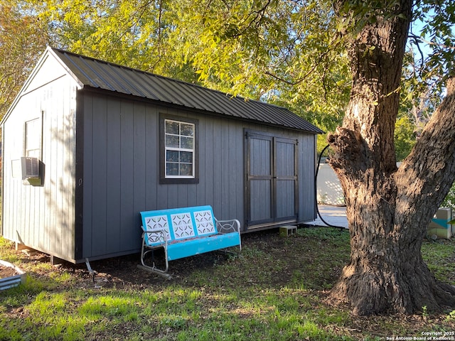 view of outbuilding featuring cooling unit