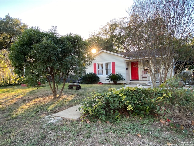 ranch-style home with a front lawn