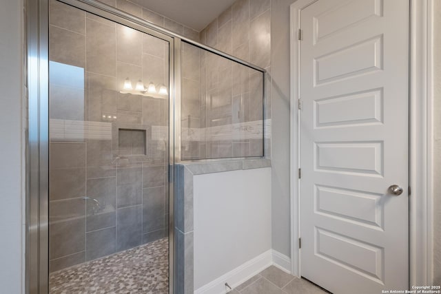 bathroom featuring tile patterned flooring and walk in shower