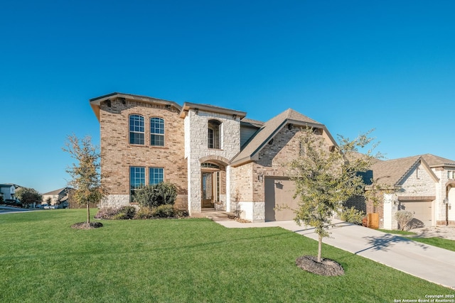 view of front of property featuring a front lawn and a garage