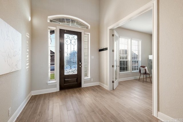 entryway with light hardwood / wood-style flooring