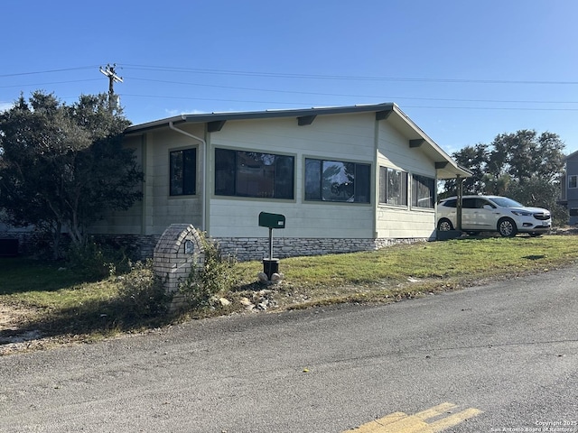 view of home's exterior featuring a lawn