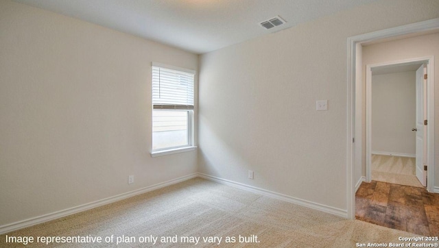 empty room featuring carpet floors