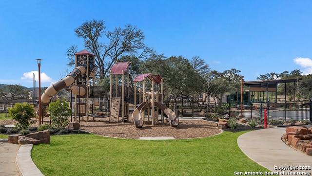 view of playground featuring a lawn