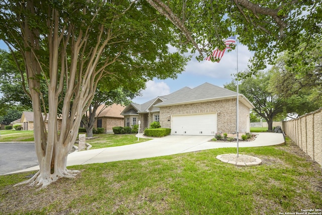 single story home with a garage and a front lawn