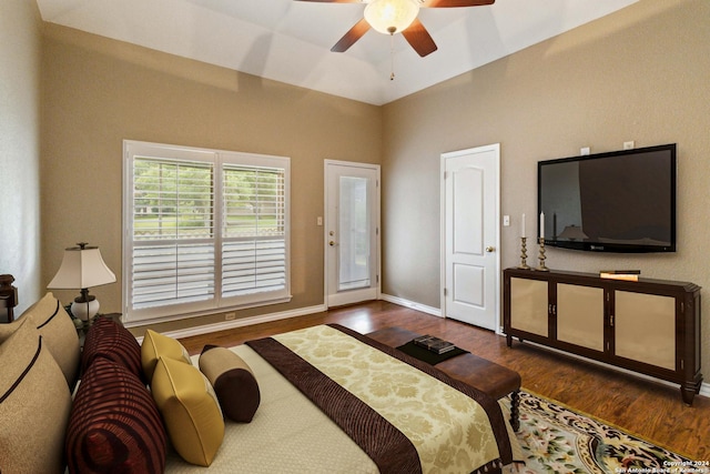 bedroom with ceiling fan and dark wood-type flooring