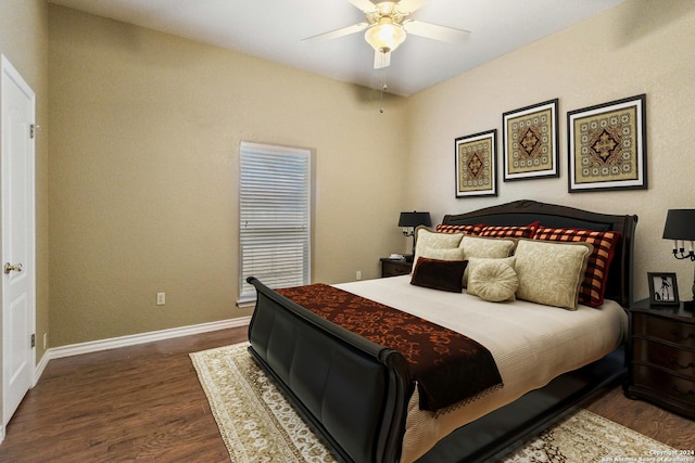 bedroom featuring ceiling fan and dark wood-type flooring