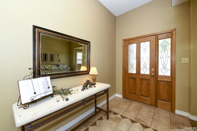 tiled foyer entrance featuring a healthy amount of sunlight