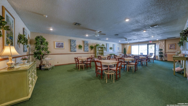 carpeted dining room featuring a textured ceiling and ceiling fan