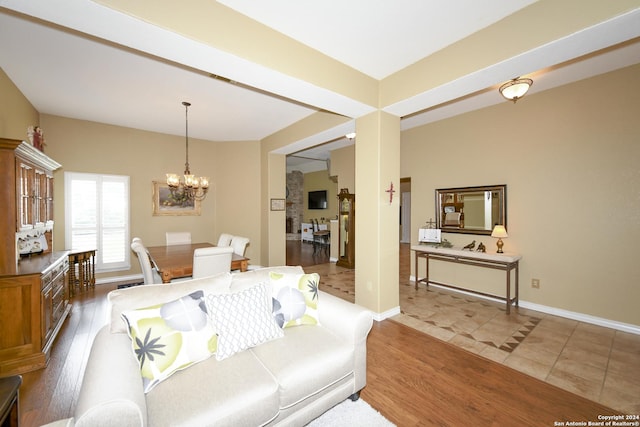 living room featuring tile patterned flooring and a chandelier