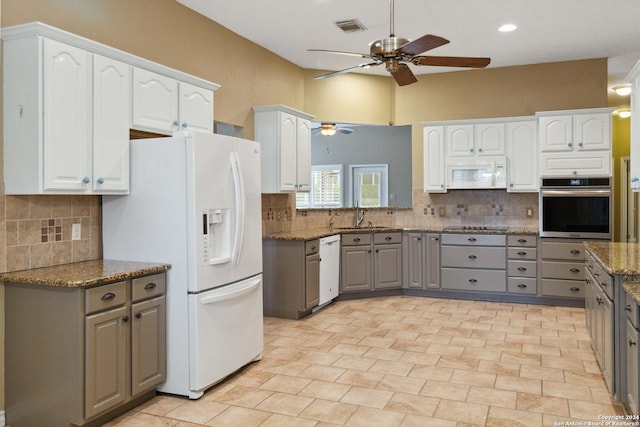 kitchen featuring gray cabinetry, white cabinets, and white appliances