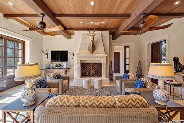 interior space featuring a ceiling fan, recessed lighting, wood ceiling, and a fireplace