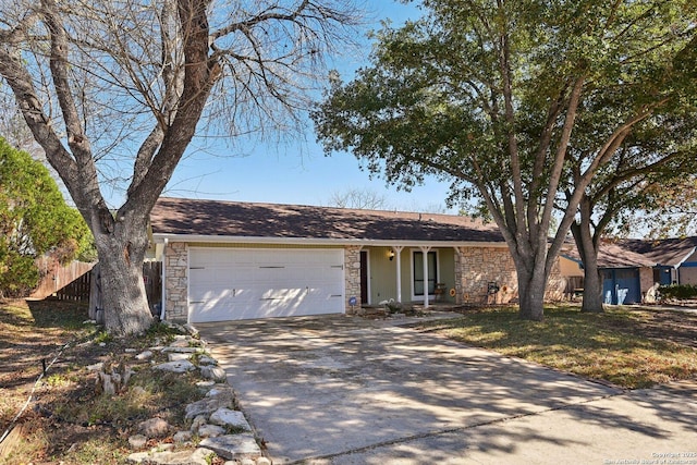 single story home featuring a garage