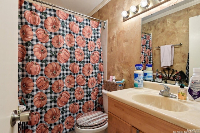 bathroom featuring vanity, toilet, and crown molding