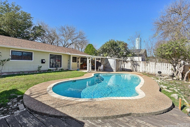 view of pool featuring a patio area and a yard