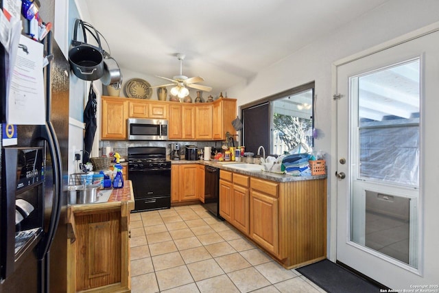 kitchen with backsplash, black appliances, sink, ceiling fan, and light tile patterned floors