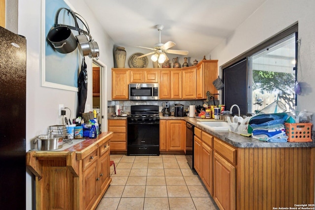 kitchen with decorative backsplash, ceiling fan, sink, black appliances, and light tile patterned floors